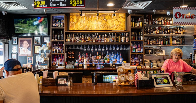 Bar and drink rack behind