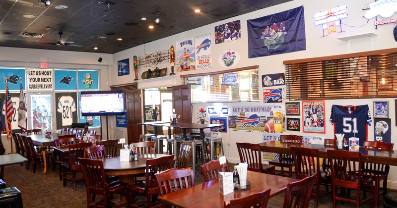 Dining area with sports decorations on the walls