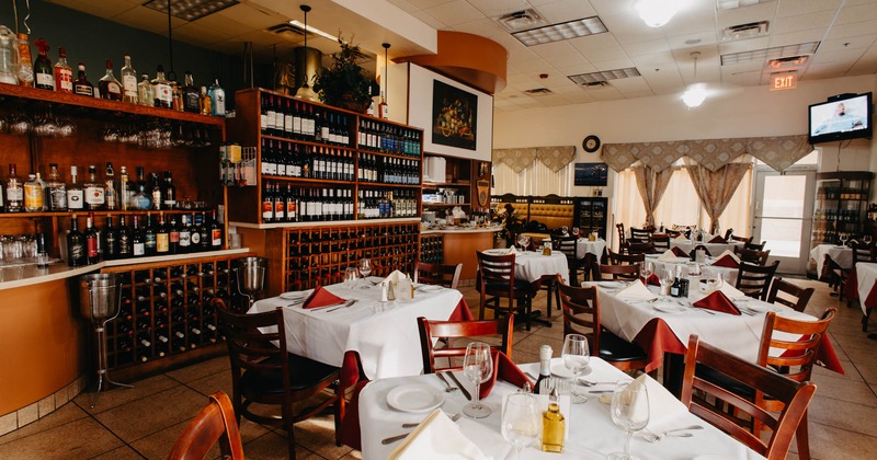 Interior, dining area, tables and chairs ready for guests