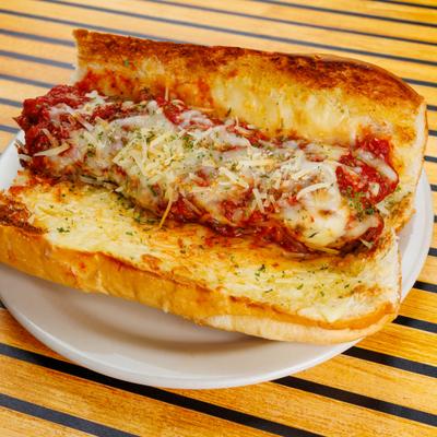 Meatball Sub sandwich served on a white plate.