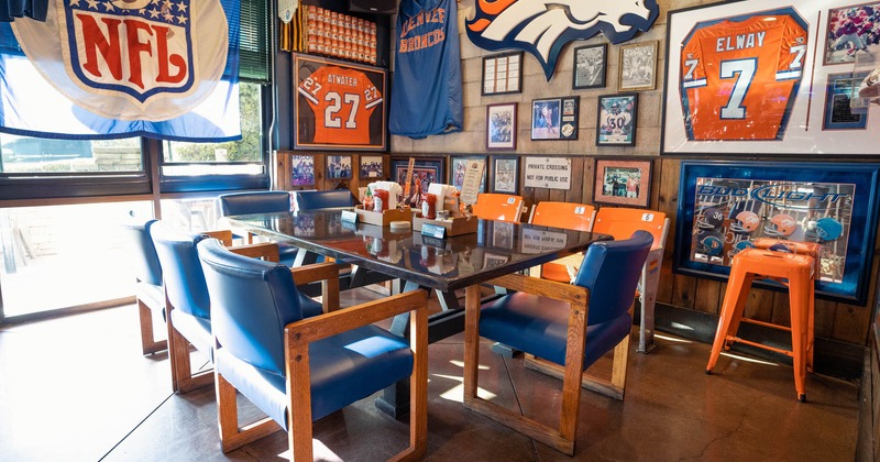 Interior, marble dining table, leather chairs, various football memorabilia