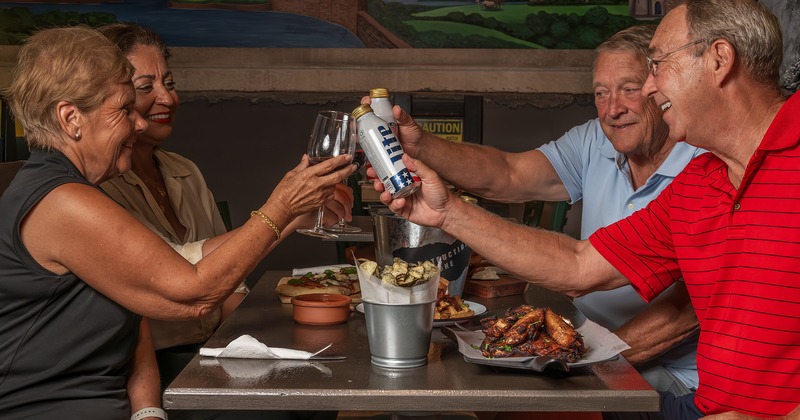 People clinking drinks