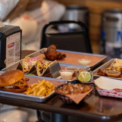 A table with diverse food platters and sides.