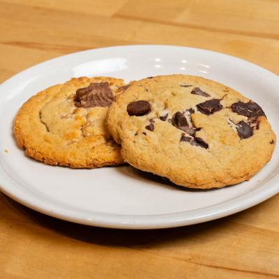 A couple of Triple Chocolate Deluxe Cookies on a plate.