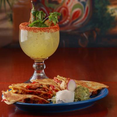 Fajita Quesadilla plate accompanied with jalapeno margarita glass