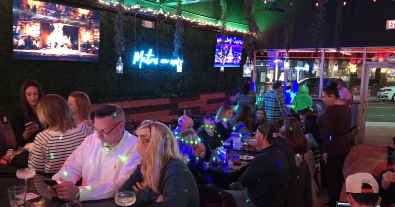 Crowd of people sitting inside