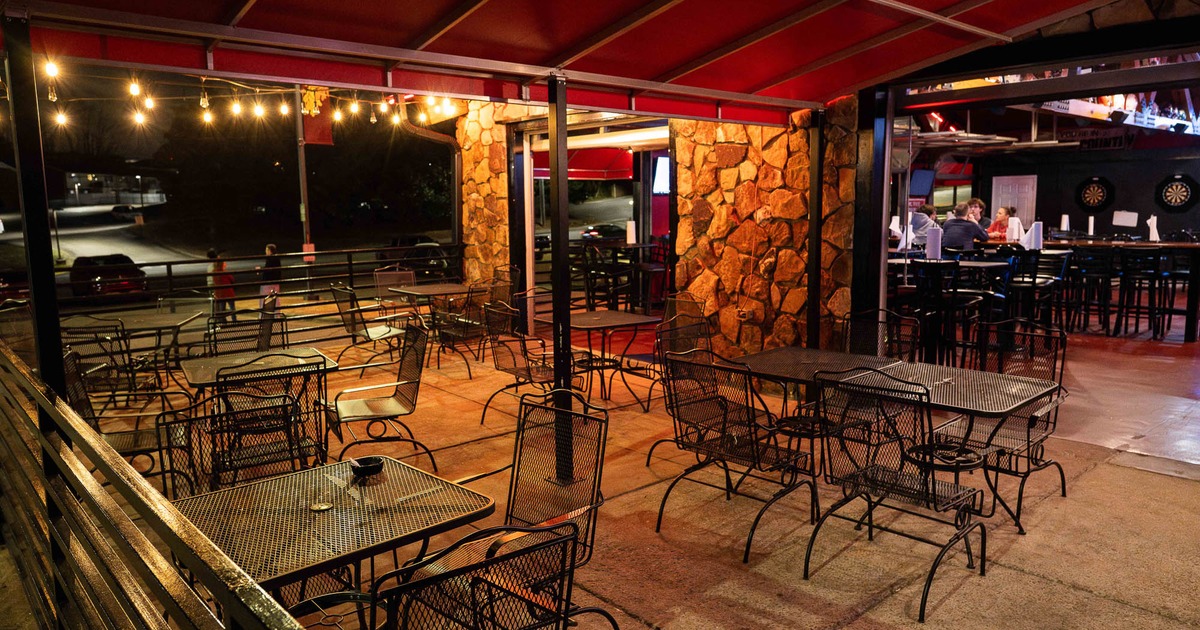 Exterior, covered patio with tables and chairs