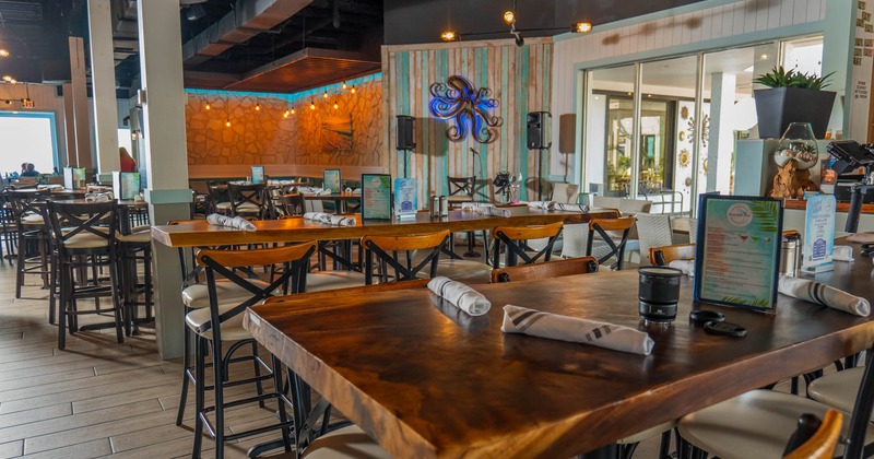 Interior, high top long dining tables with stools