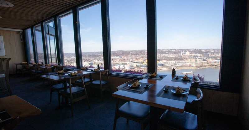 Interior, dining area, tables for two and four by the windows, panoramic view