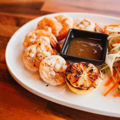 Grilled shrimp, root vegetables, grilled lemon and a sauce