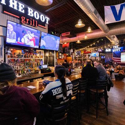 guest watching tv and drinking