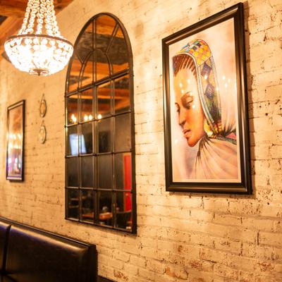 DIner room, decorated wall, paintings on the wall.