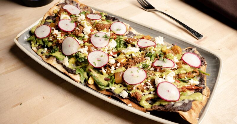 tostada with cheese and radish on top