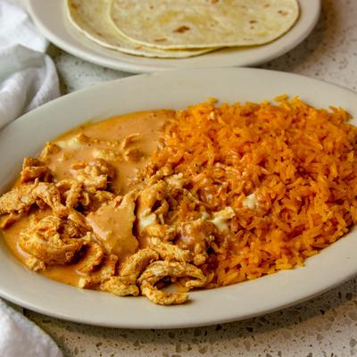 Grilled chicken, marinated in chipotle sauce, with cheese, and Mexican rice.