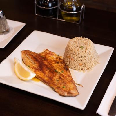 Fish filet with a side of rice.