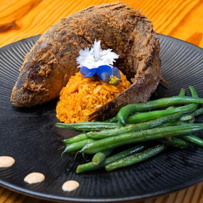Fried red snapper, with rice and green beans.