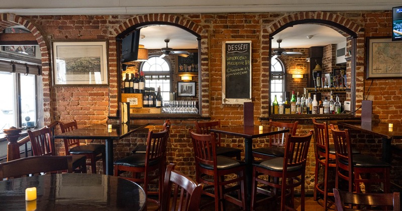 Interior, tables and chairs near the bar