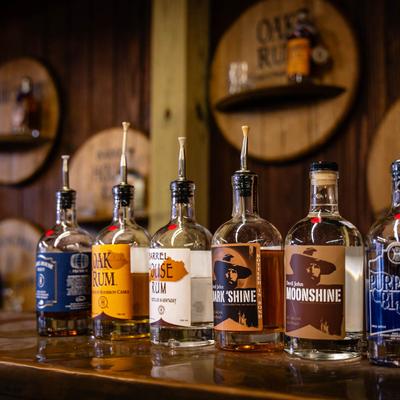 Barrel House Distilling, all spirits on tasting counter, group shot.