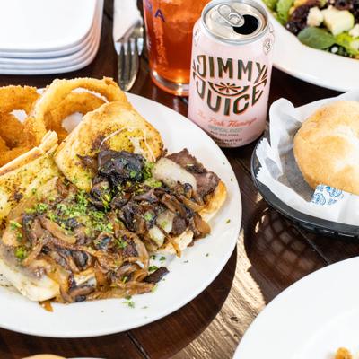 The steak sandwich and drinks.