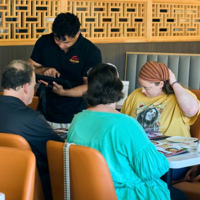 Employee tending to customers.