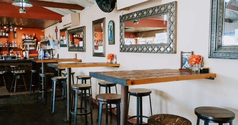 Interior, wooden high top tables with stools