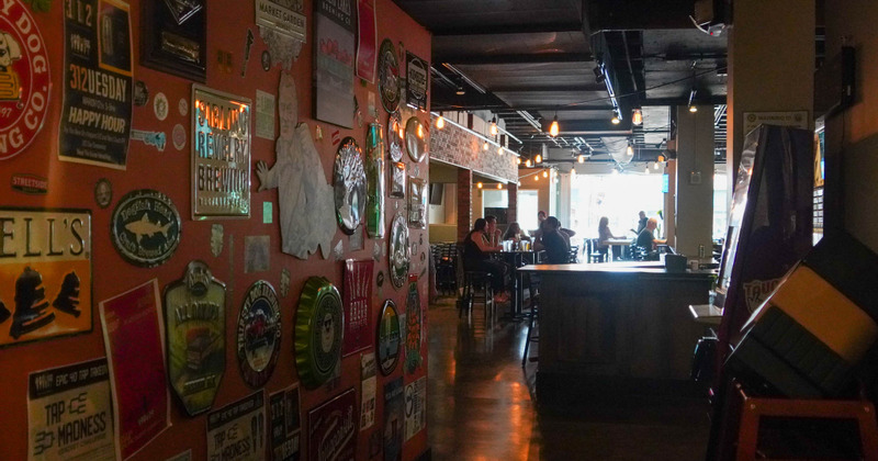 Interior decorated wall with people enjoying in the background
