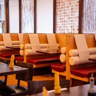 Restaurant space with booths and tables.