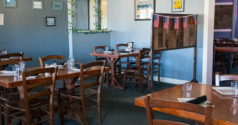 Interior, tables and chairs in dining area