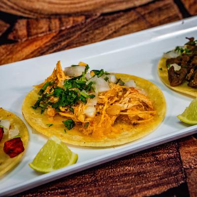 Tacos, Al pastor, pulled chicken, and steak.