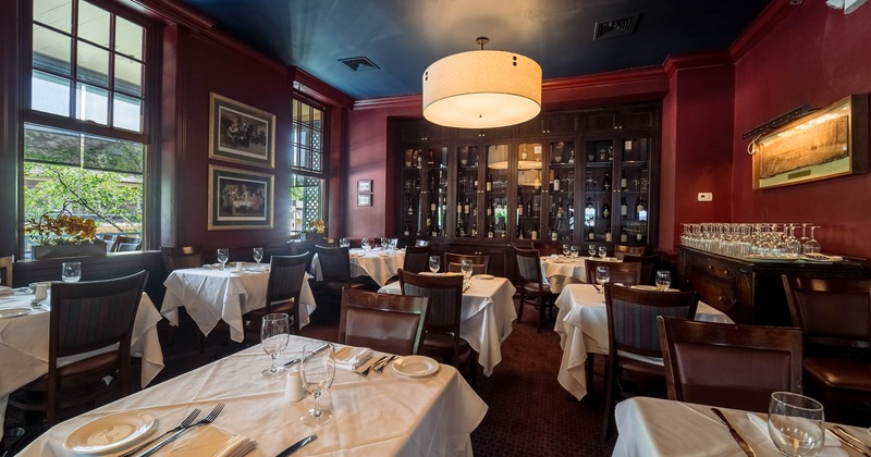 Interior dining area, tables covered with white cloth