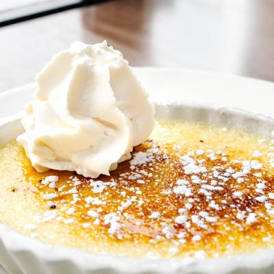 Creme Brulee topped with homemade whipped cream.