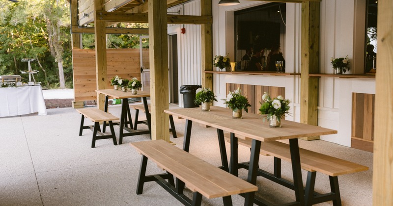 An outdoor patio area set up for a wedding reception or party