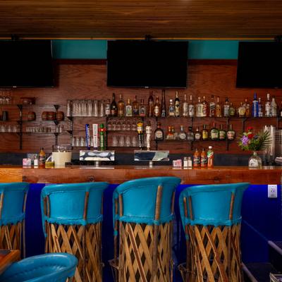 The bar area, stools.