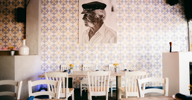 Interior, tables ready for guests, picture on the wall