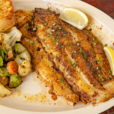 Seasoned Grilled Fish Fillets served with a Fresh Side Salad, Your Choice of Side & Garlic Bread.