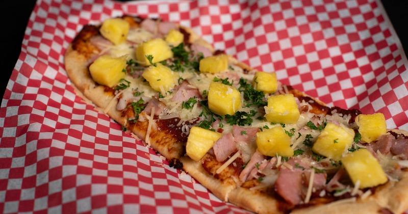 Flatbread with Canadian bacon, cheese, and pineapple