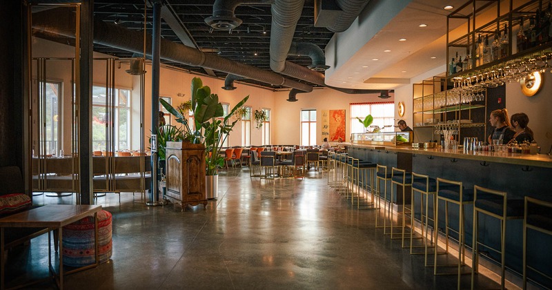 Interior, spacious dining area with tables and chairs