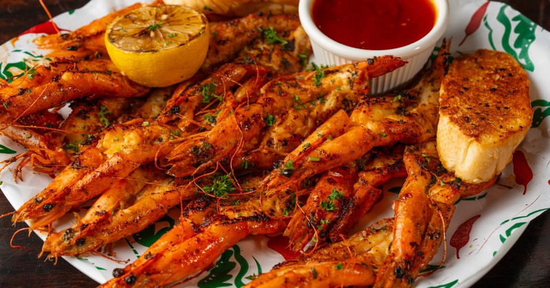 Grilled Mexican-style shrimp with dipping sauce, close-up