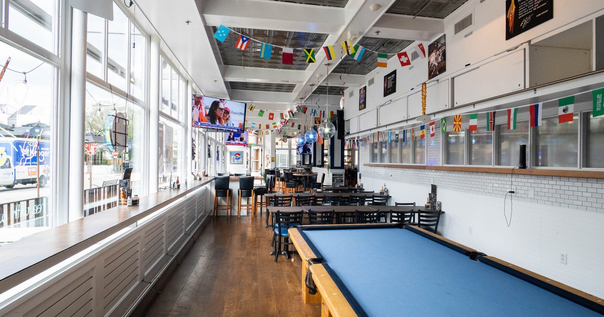 Interior, game area, billiards table, dining and bar area in the back