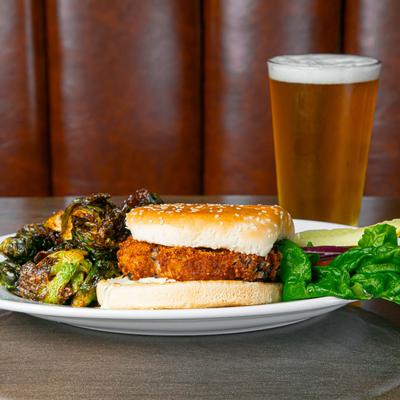 Veggie Burger with brussels sprouts and a beer.