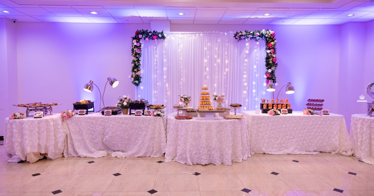 An elegantly decorated venue set up for a special event, such as a wedding