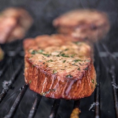 steak on a grill.