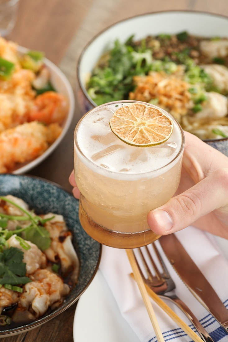 Customer holding a cocktail