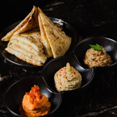 Pita bread and hummus dipping sauces