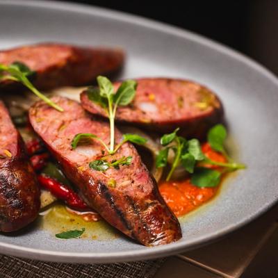 Sausage served in the plate.