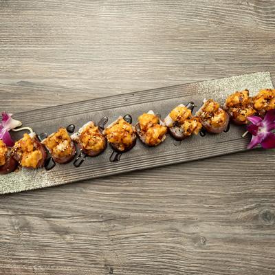 Crab, tuna, and shrimp tempura rolls, topped with eel sauce and spicy mayo.