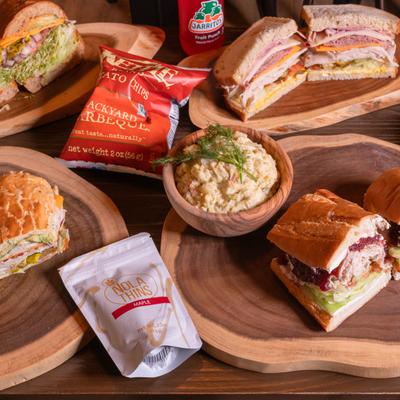 Sandwich boards, sides, and snacks.