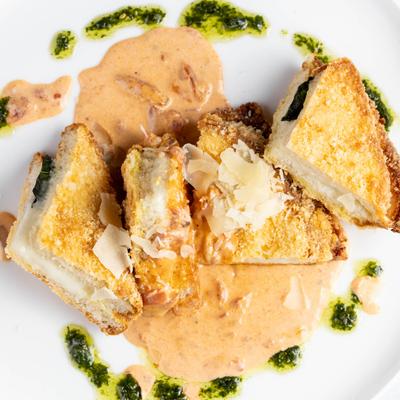 Fried mozzarella sandwiches in vodka sauce.