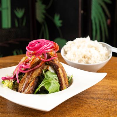 Crispy Pork Belly, with pickled red onions.
