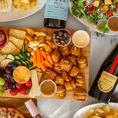 Buddy Board with cheese, meat, crackers, nuts, veggies and seasonal fruit.